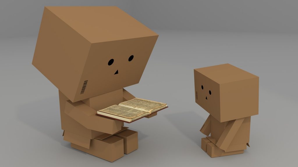 cardboard man, a book, read